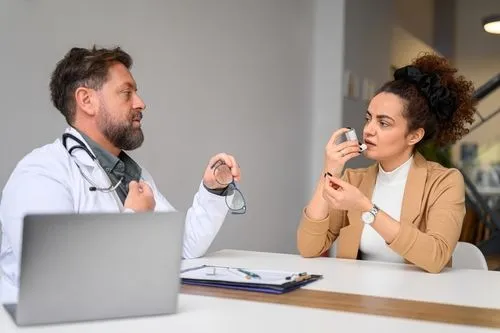 Woman consulting a doctor for asthma evaluation and treatment