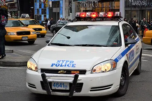 NYPD police car with lights on