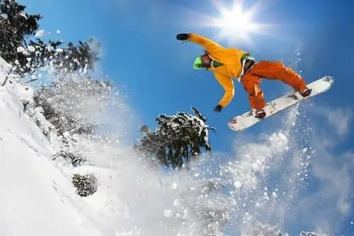 man on snowboard taking air