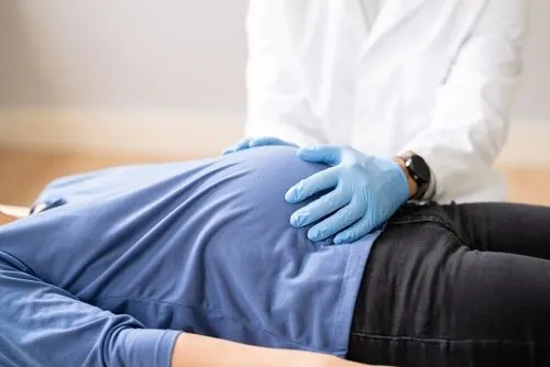 Pregnant woman receiving chiropractic treatment