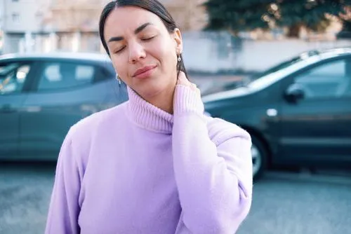 Woman with whiplash injury from car collision in St. Cloud, FL seeking chiropractic treatment.