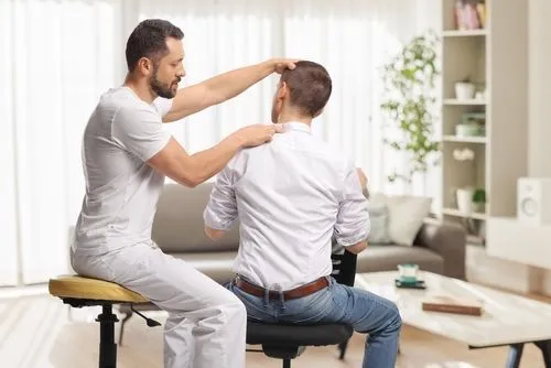 Patient undergoing adjustment with a chiropractor.