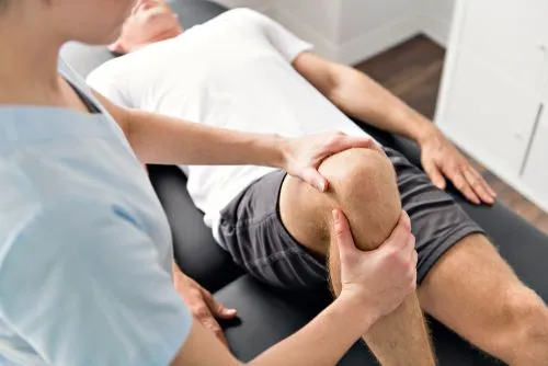 Injury rehabilitation session with chiropractor and client