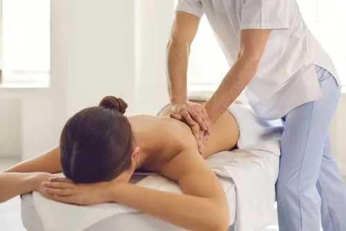 Woman receiving chiropractic massage therapy