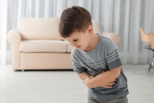 A child showing signs of constipation and abdominal discomfort.