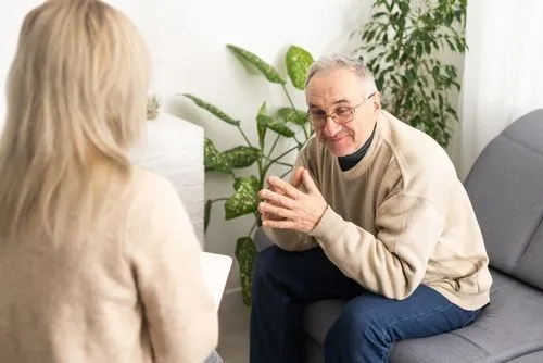 Elderly man participating in a therapy session for emotional and mental health support
