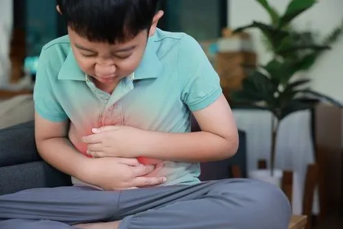 Young boy suffering from constipation