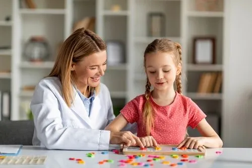 Pediatrician evaluating a young patient for learning difficulties.