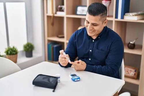 Man measuring his sugar by using glocometer