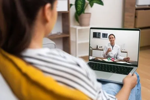 Woman during her telehealth consultation with doctor
