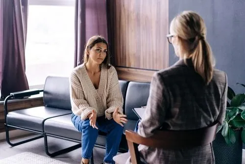 Woman attending therapy session for obsessive-compulsive disorder (OCD).