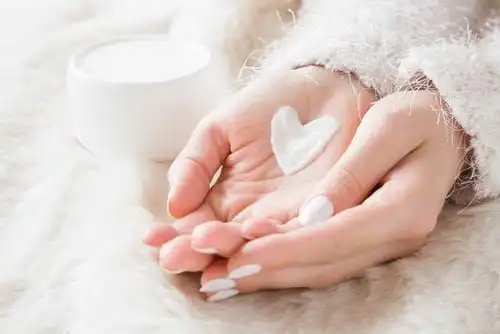 hand with lotion shaped heart