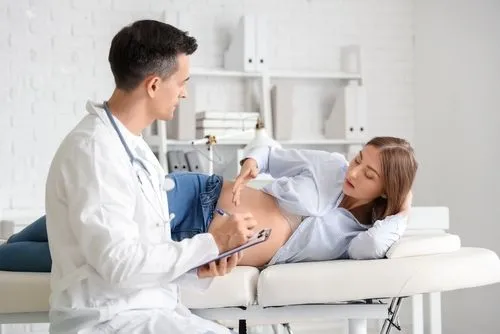 Doctor checking the Pregnant woman on clinic