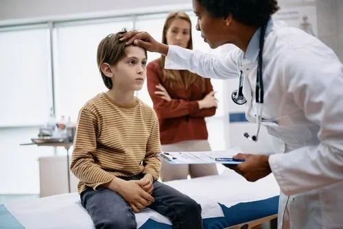 Child being examined by a pediatrician due to illness