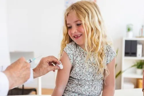 Pediatric immunization being prepared for a child