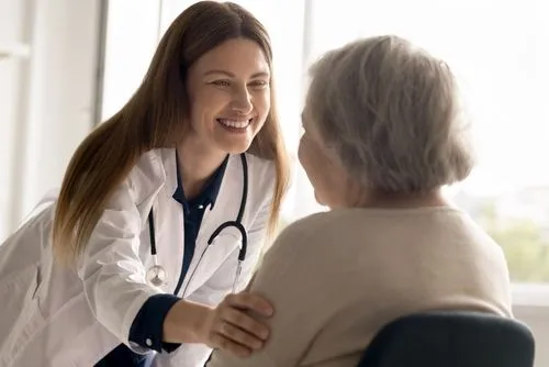 Primary care doctor consulting with an elderly patient