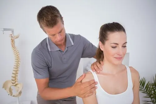 Highly rated chiropractor providing treatment to a female patient