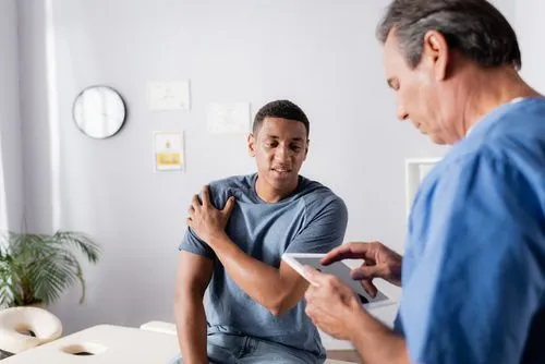 Athlete visiting a sports chiropractor for injury treatment