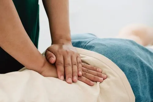 Female patient undergoing a chiropractic adjustment for spinal health
