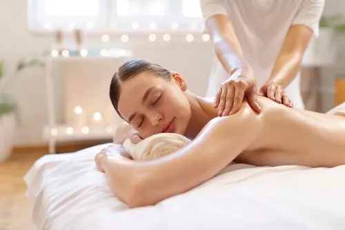 Chiropractor providing therapeutic massage to a female patient