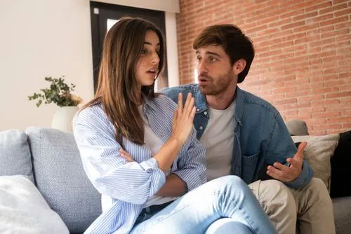 Couple arguing at home due to unresolved relationship concerns