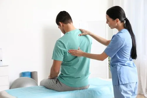 Vancouver, WA chiropractor helping client improve posture with spinal adjustments.
