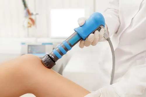 Close-up of shockwave therapy session targeting knee pain and tissue recovery
