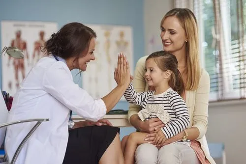 child being seen by pediatrician
