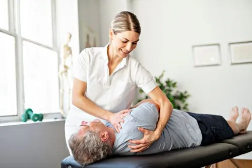 Functional medicine chiropractor performing adjustment on male patient