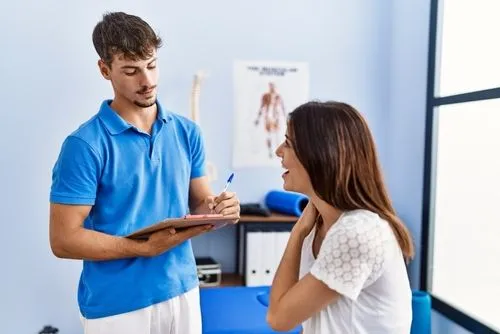 Functional medicine session of woman with chiropractor