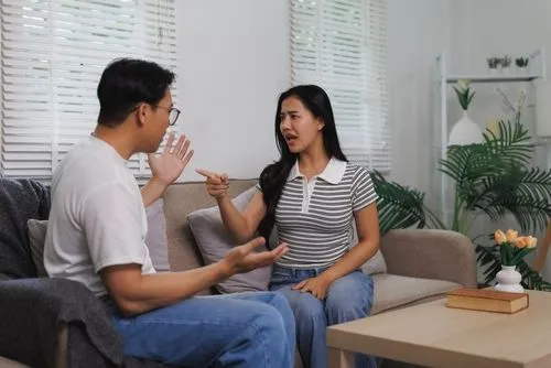 Asian man and woman quarelling each other