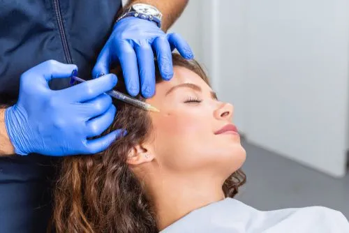 Woman getting Botox injection for headache management