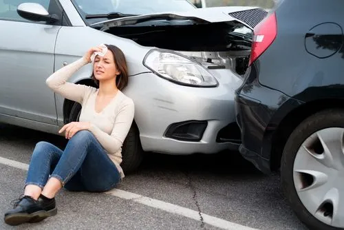 Woman suffering from headache after a car accident