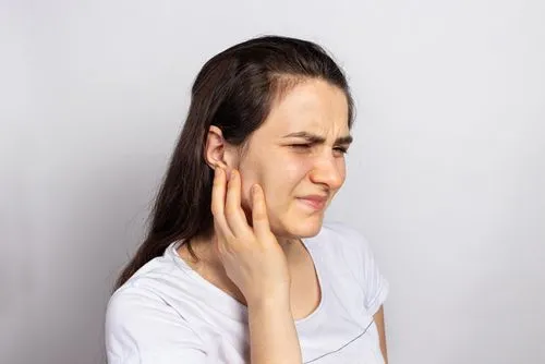 Woman with TMJ disorder and headaches.