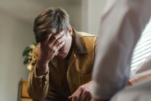 Man participating in a therapy session for post-traumatic stress disorder (PTSD).