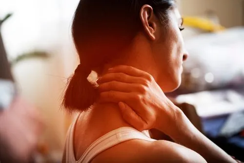 Woman suffering from neck pain