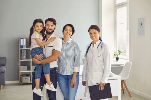 family and doctor smiling