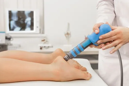 Patient receiving shockwave therapy for heel pain relief