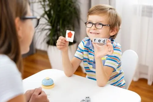 Child participating in quick thinking test with flashcards.