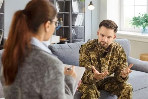 A military veteran participating in therapy for trauma and post-traumatic stress disorder.