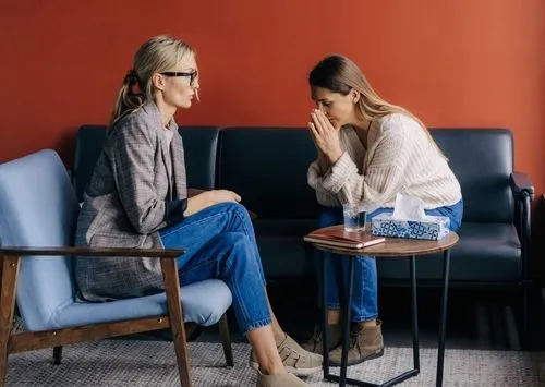 Woman participating in trauma therapy with a licensed therapist