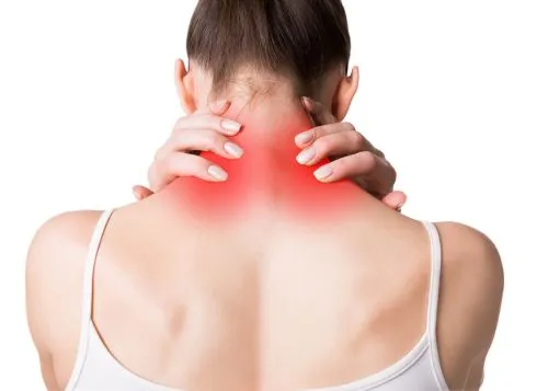 Woman seen from behind holding neck in pain