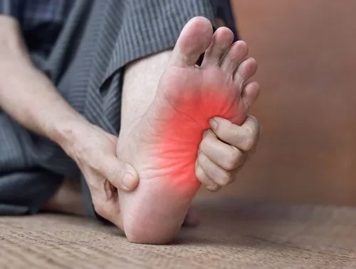 Illustration of foot tingling on a person with red highlights