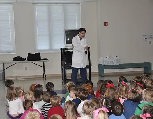Dr Byrd - speaking to a group of children about good dental health