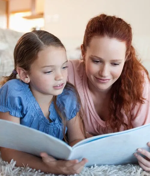 Woman reading with child
