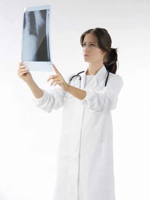 female_dr_looking_at_xray.jpg
