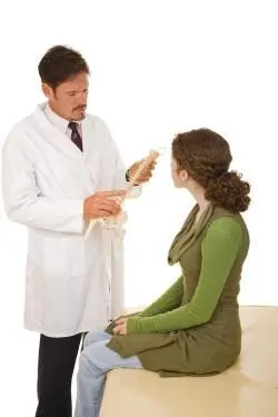 chiropractor advising treatment to a patient 