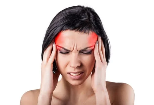 woman enduring headaches