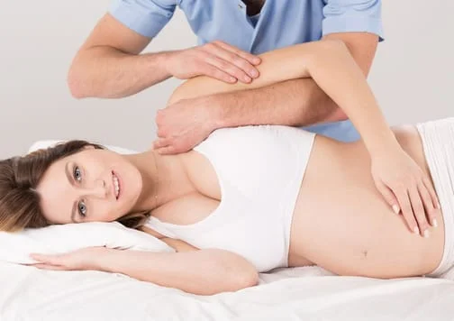 pregnant woman getting chiropractic care