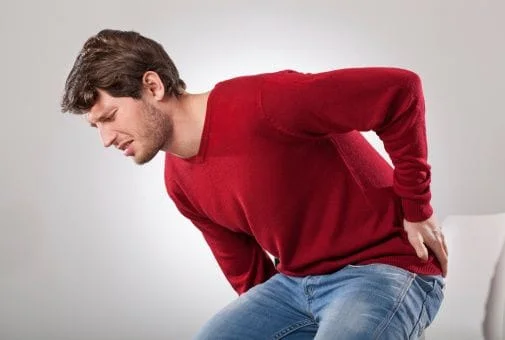 Man with back pain in Sugar Land TX